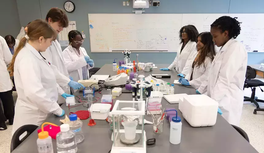 A group of biochemistry students in the lab during the iGEM competition.