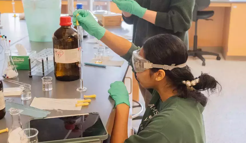 An organic chemistry student works with solutions in the lab.
