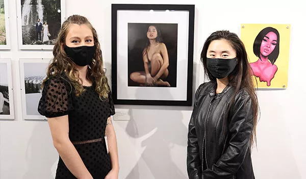 Students in front of artwork
