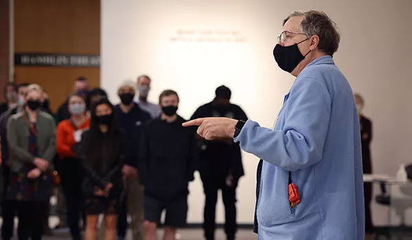 Sven Anderson giving a presentation on art