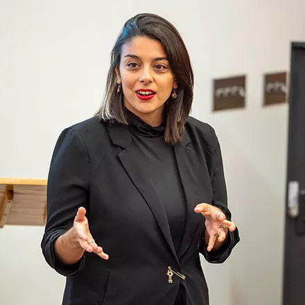 Olivia speaks at Red Dragon Food Pantry opening