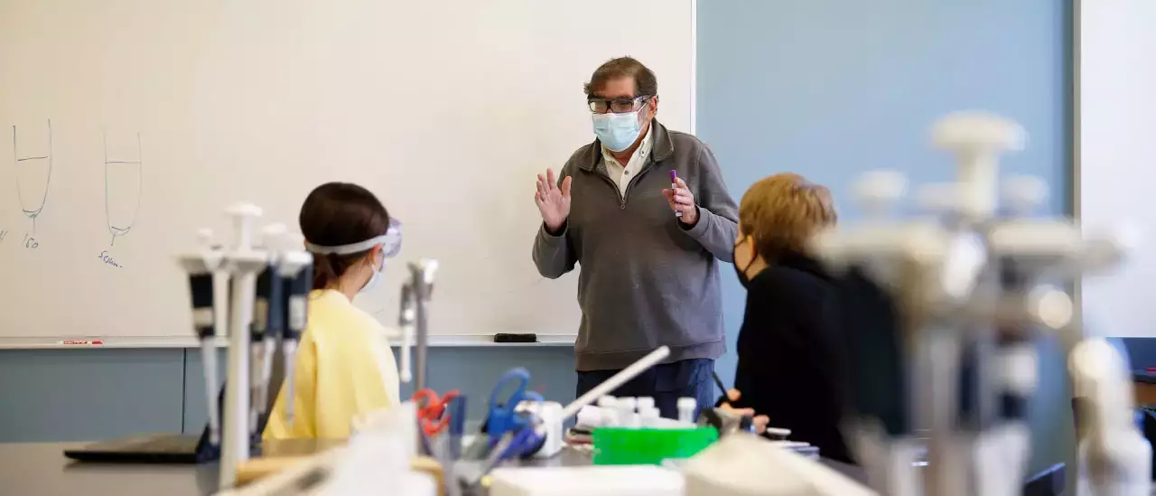 Professor working with students