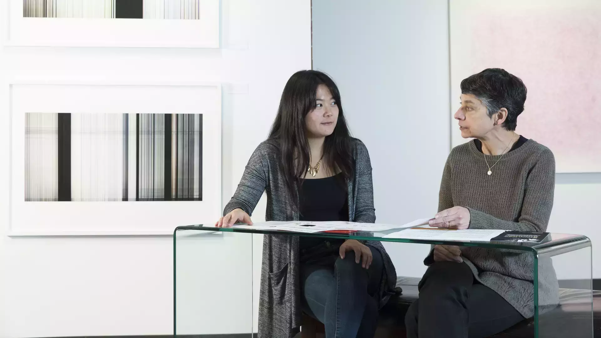 Kathy Spitzhoff, assistant professor of graphic design at SUNY Oneonta, advises studio art major Briela Tollisen.