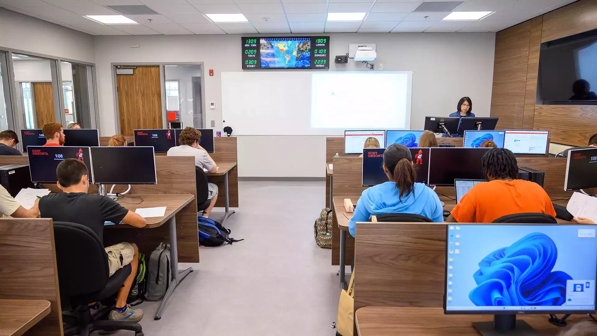 Dona Siregar instructs students in a corporate finance class.