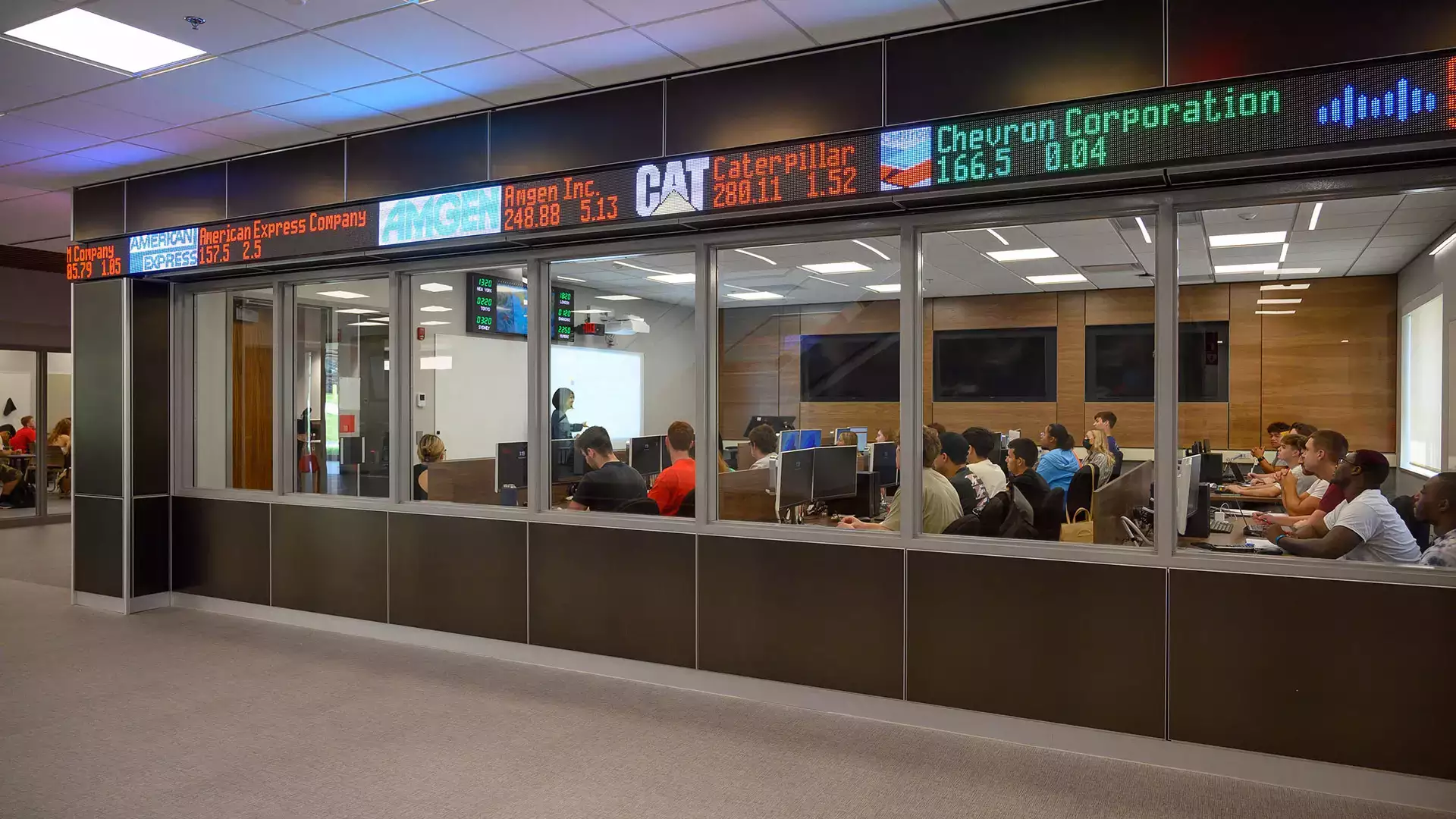 Stock ticker scrolls above the windows of the Bloomberg Room.