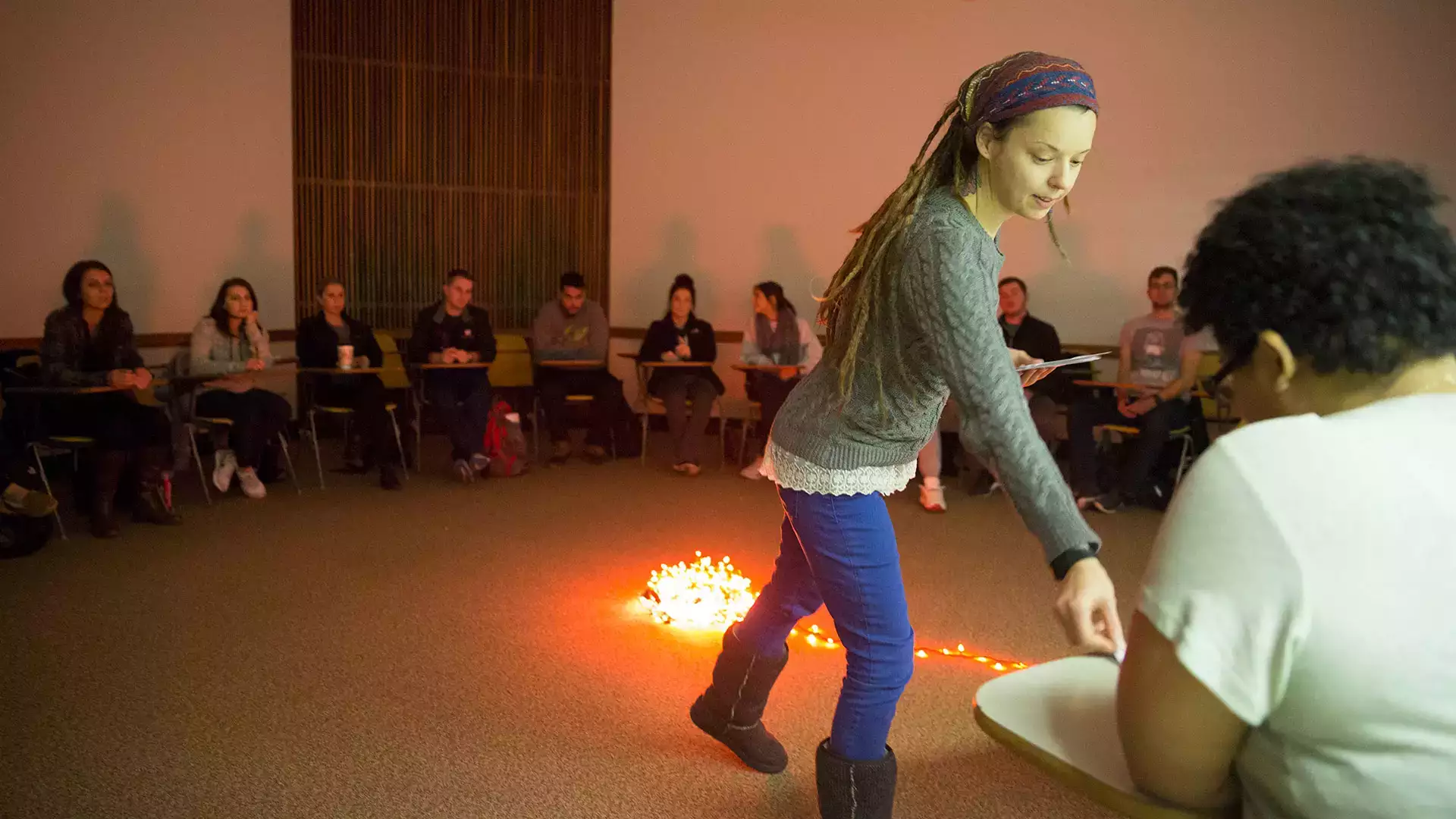 Assistant Professor Kristen Blinne leads a mock fireside chat.
