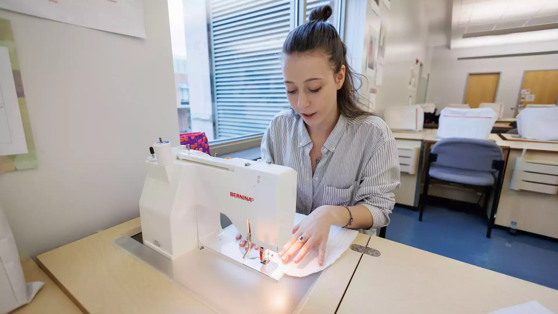 Learning sewing during a textiles and fashion class