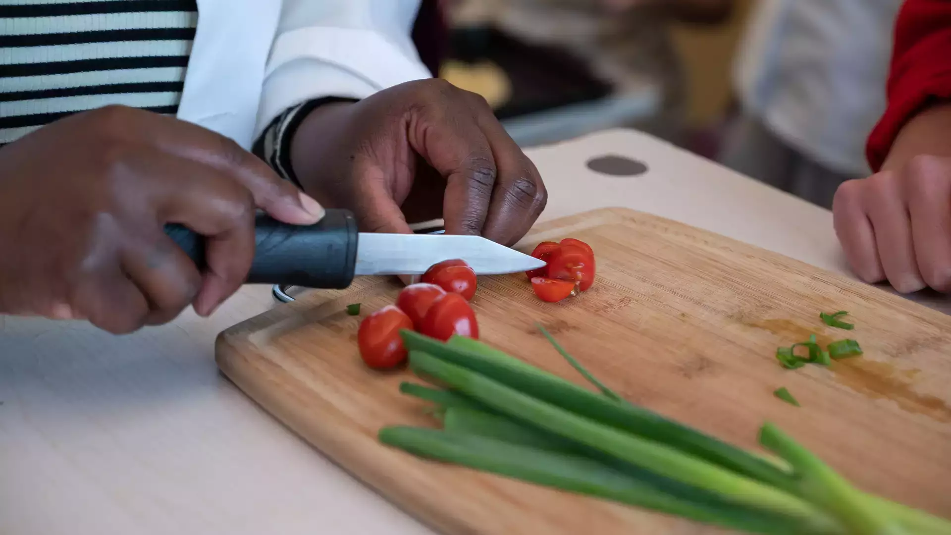Prepping vegetables as part of a cooking class