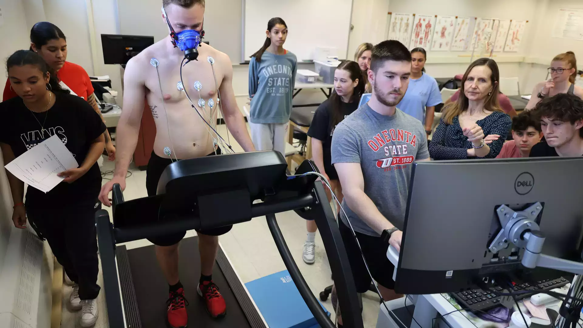 Assistant Professor Lisa M Rusch of the Department of Sport and Exercise Sciences works with students in the lab