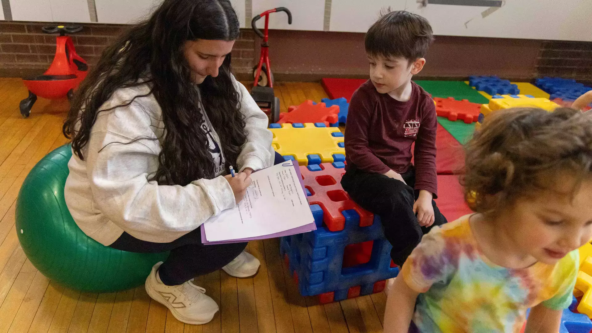 Exercise Science student working with kids in the Bugbee Children's Center