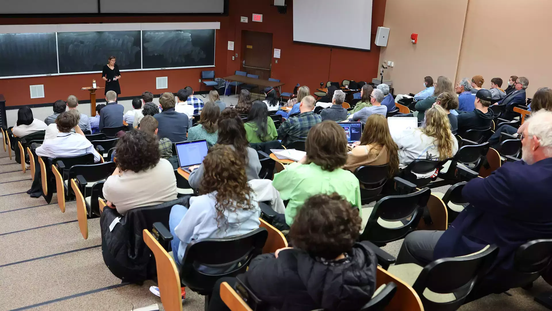 Large group of people seated in a lecture hall