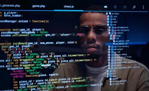 Computer science majors reflection on screen while programing code